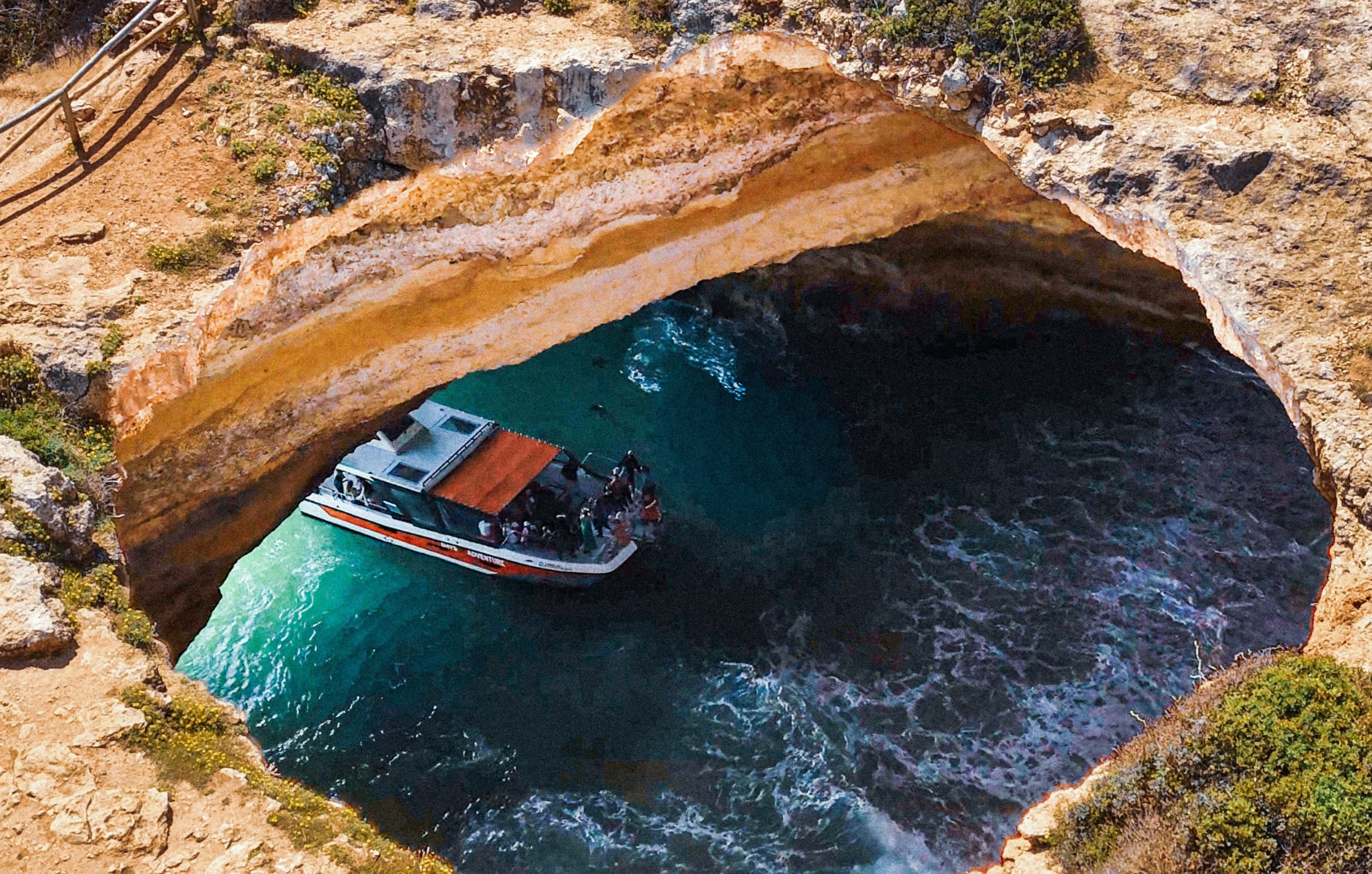 Catamaran sailing near the famous Benagil cave
