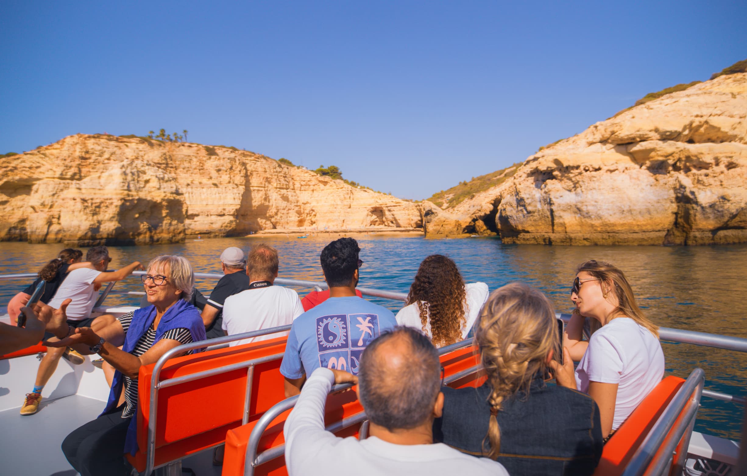 Passengers enjoying a dolphin watching and Benagil cruise
