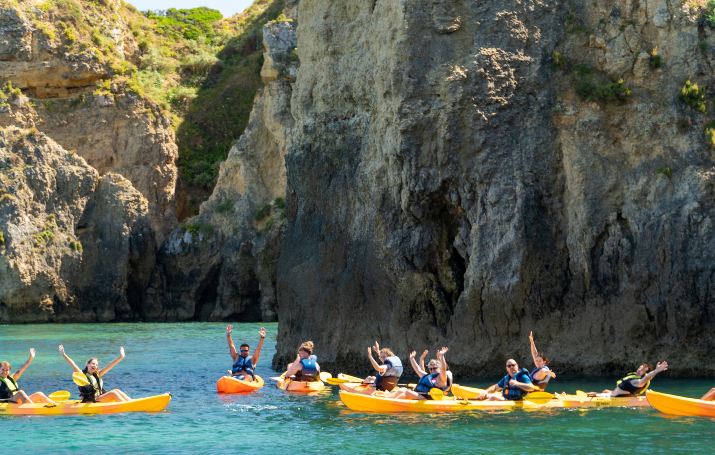 Kayakers discovering sea arches and caves in Ponta da Piedade