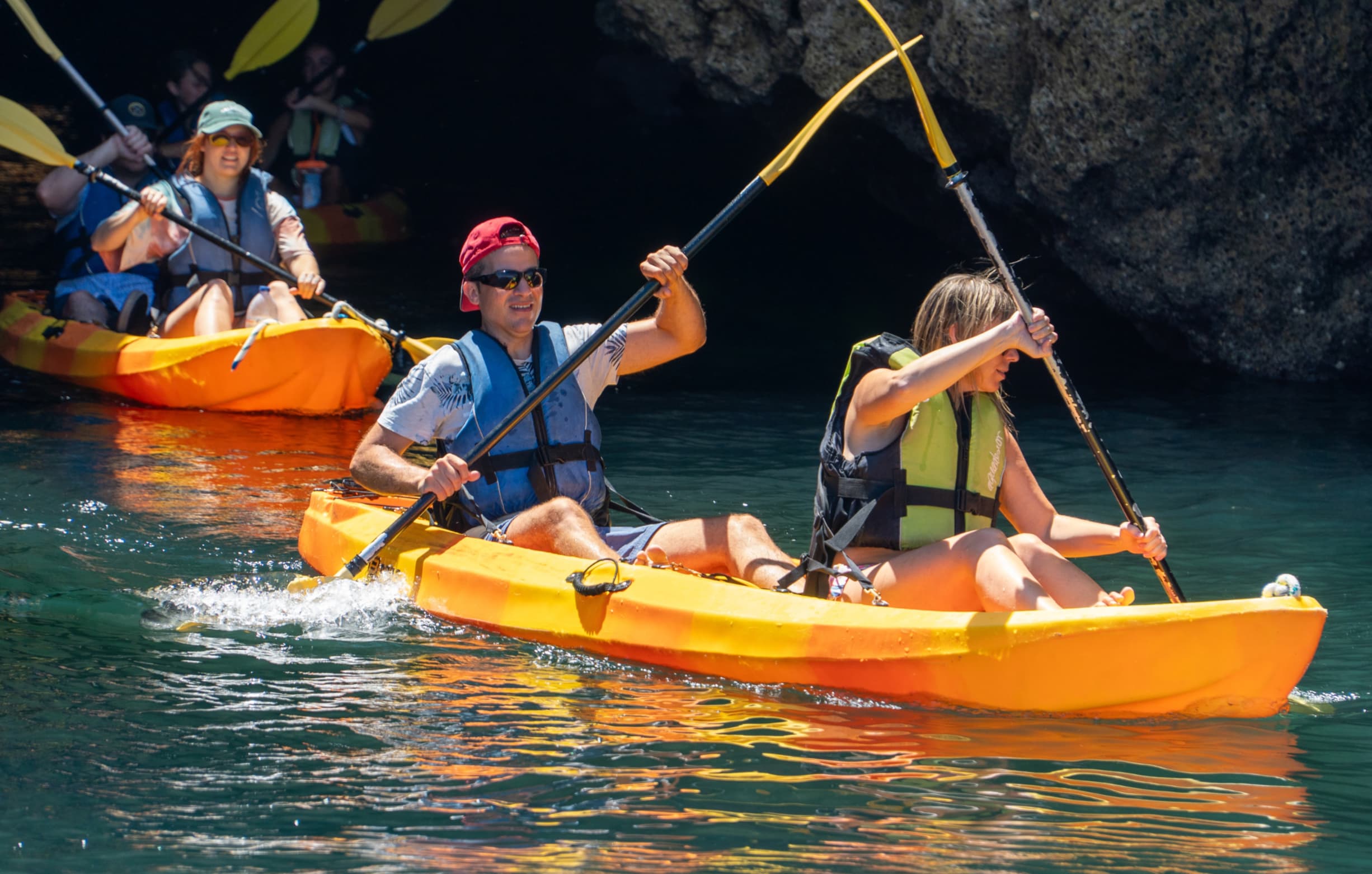 Passengers kayaking along the coastline of Ponta da Piedade Algarve